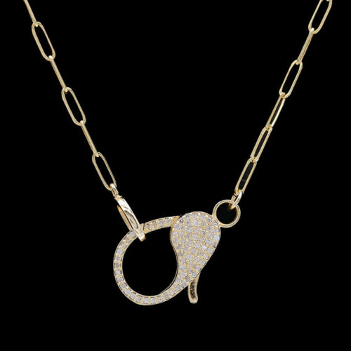 a gold chain with a diamond pendant on it