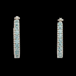 a pair of blue and white diamond hoop earrings