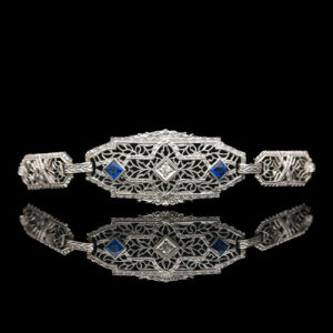 an art deco bracelet with blue stones and filigrees