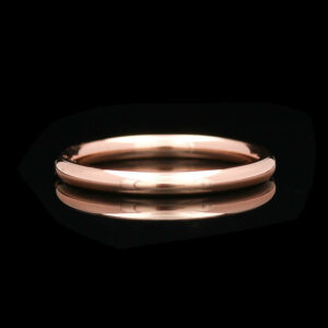 a gold ring on a black background
