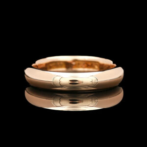 a gold wedding band with two circles