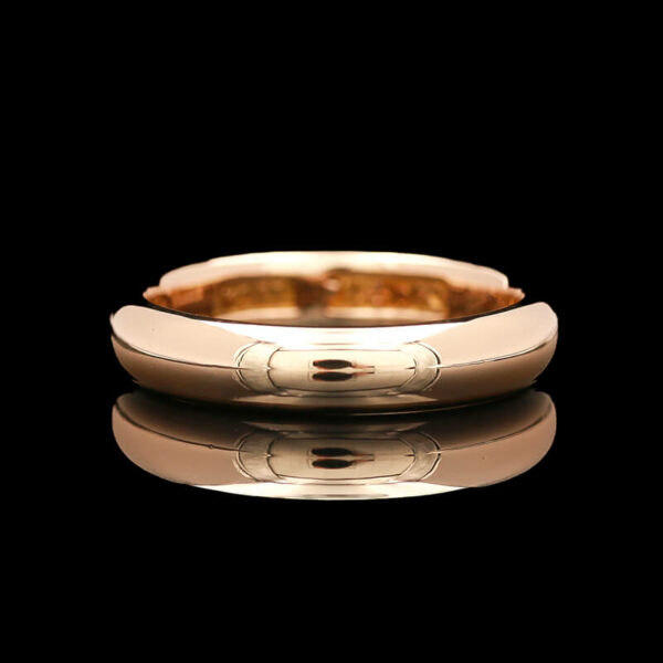 a gold wedding band with two circles