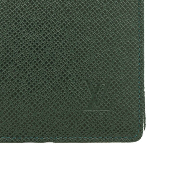 a green wallet with a logo on it