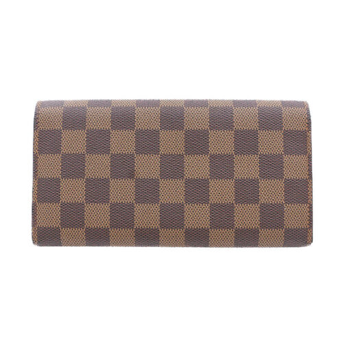 a brown and black checkered wallet on a white background