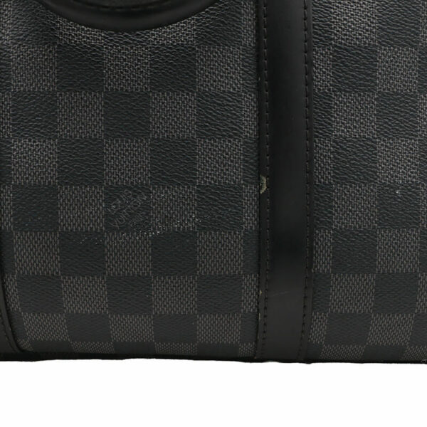 a louis vuitton bag is shown in black