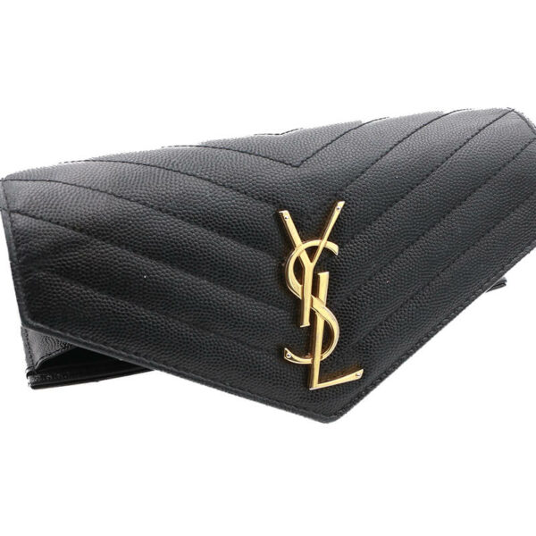a saint laurent black leather wallet on a white background