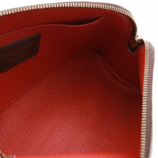 the inside of a red leather purse