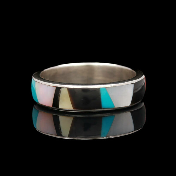 a wedding ring with a multicolored pattern on it
