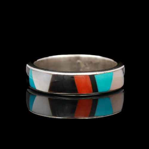 a silver ring with an orange, blue and black stripe