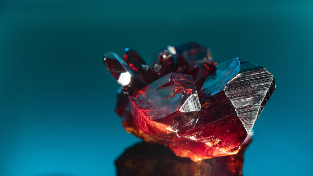 a piece of red and blue crystals on a table