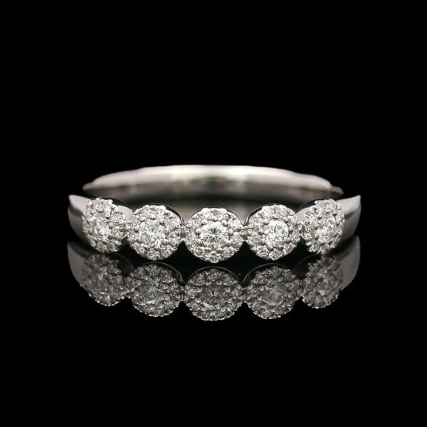 a white gold ring with five round diamonds