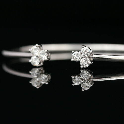 a pair of white gold and diamond rings