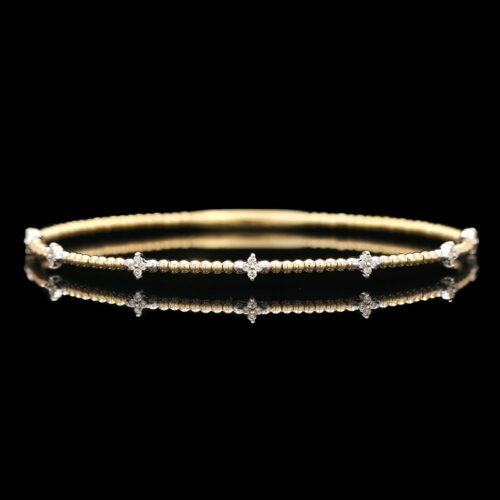 a gold and diamond bracelet