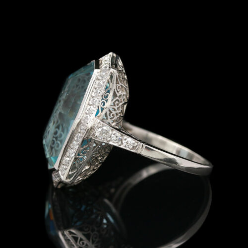 an art deco ring with diamonds and blue topaz