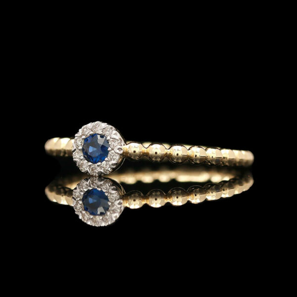 a diamond and blue sapphire ring