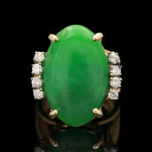an oval jade and diamond ring