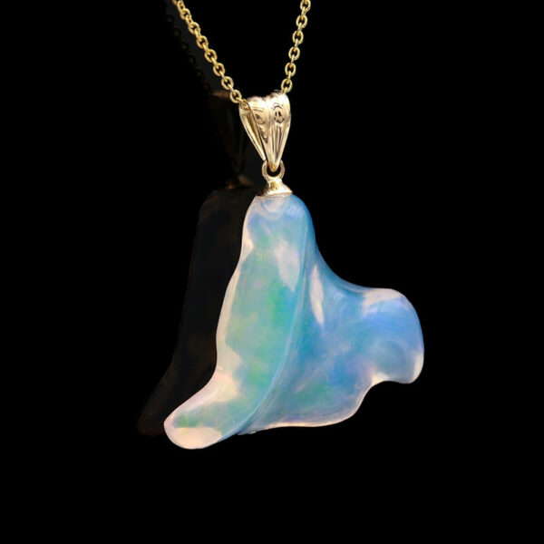 a pendant with a blue and white shell on it