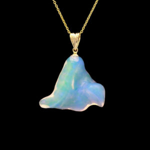 a pendant with an opal stone in the shape of a triangle