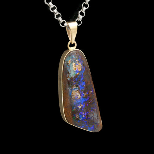a pendant with a large boulder stone in it