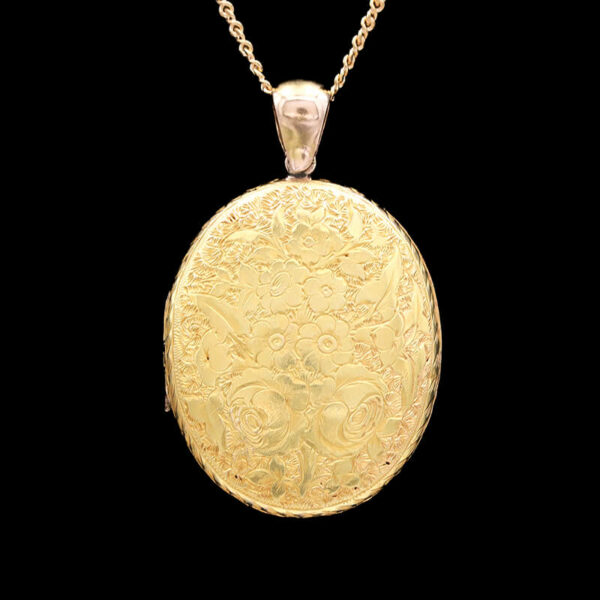 an antique yellow gold pocket watch on a chain