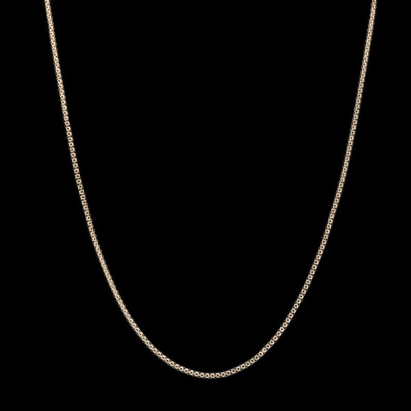 a gold chain on a black background