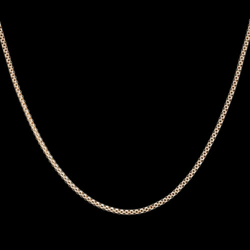a gold chain on a black background