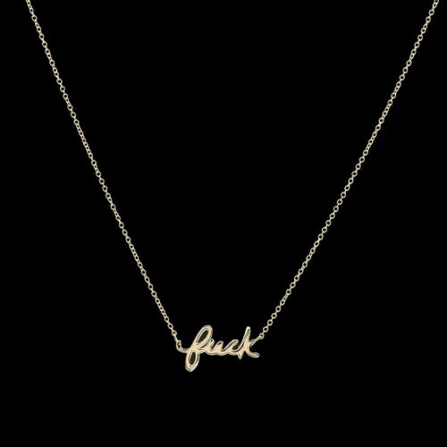 a gold necklace with the word luck on it