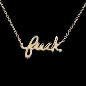 a gold necklace with the word'peek'written in cursive font