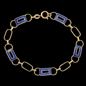 a gold bracelet with blue squares on it