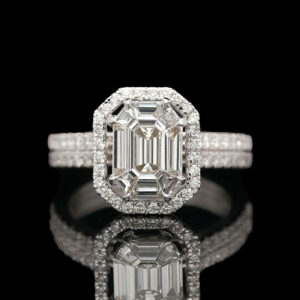 an emerald cut diamond ring with diamonds surrounding it