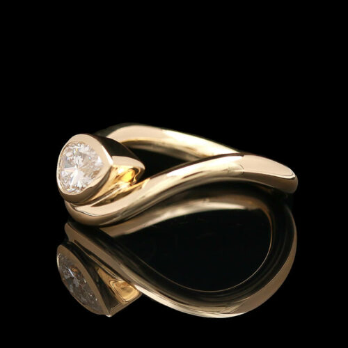 a gold ring with a diamond on it