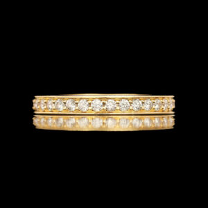 a yellow gold wedding band with diamonds