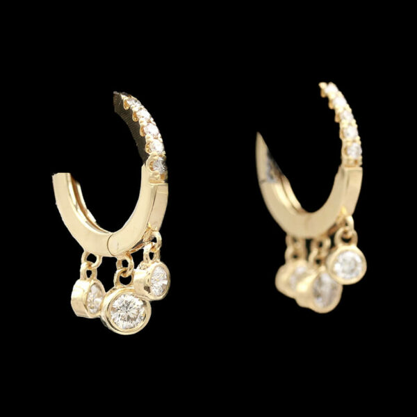 two pairs of gold earrings with diamonds