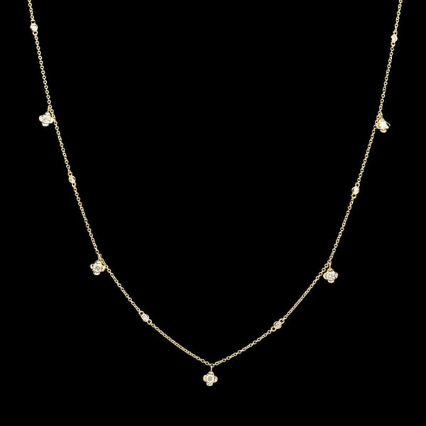a gold necklace with diamonds on it