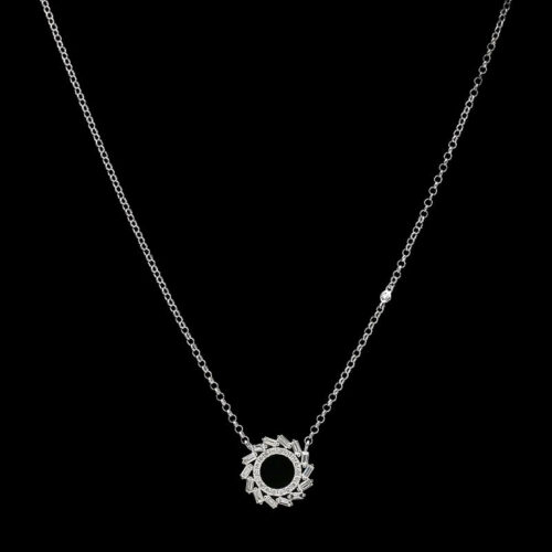 a white gold necklace with diamonds on a black background