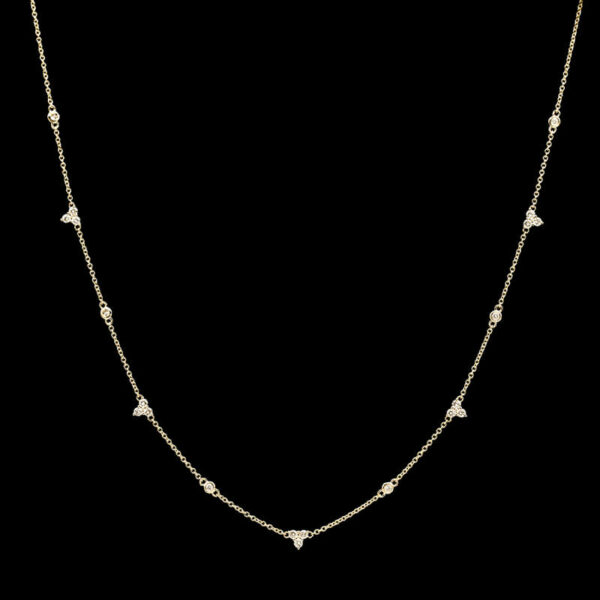 a necklace with diamonds on a black background