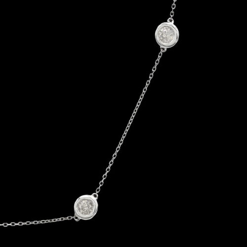a diamond necklace on a black background