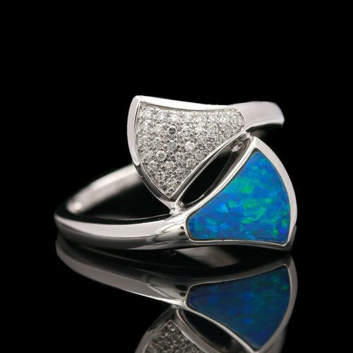 an opal and diamond ring on a black background