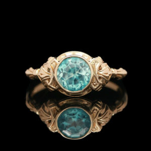 an antique ring with a blue stone in the center