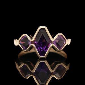 a ring with purple stones on it