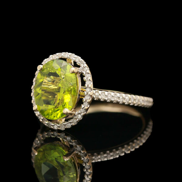a fancy ring with an oval cut yellow diamond