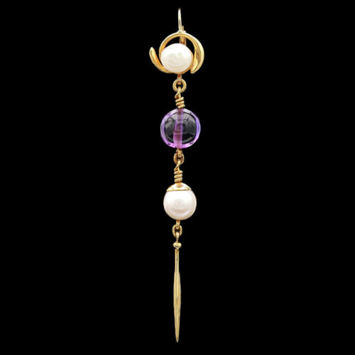 a gold and amethyst necklace with pearls