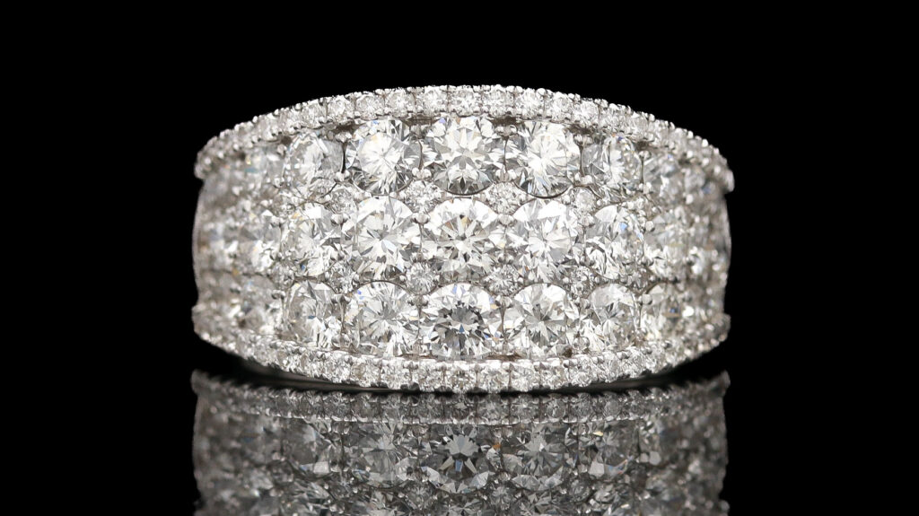 a diamond ring on a reflective surface