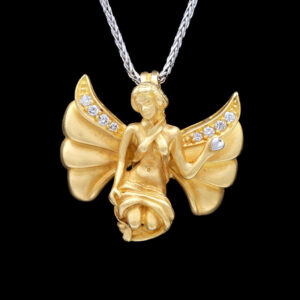 a gold angel necklace with diamonds on it