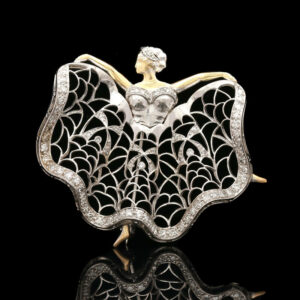 a white gold and diamond brooch depicting a woman's head