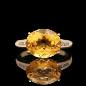 a yellow sapphire and diamond ring