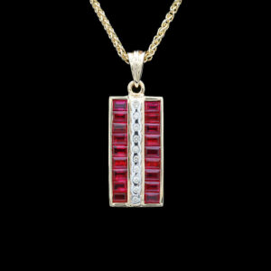 a red and white necklace with diamonds on it