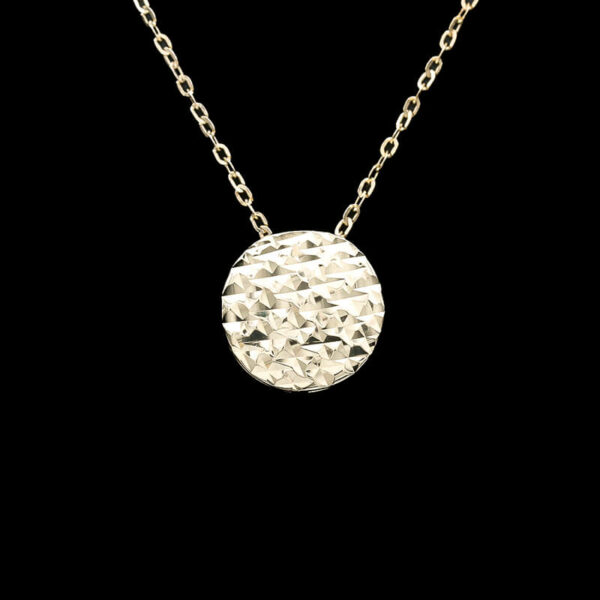 a gold necklace with a circular design on it