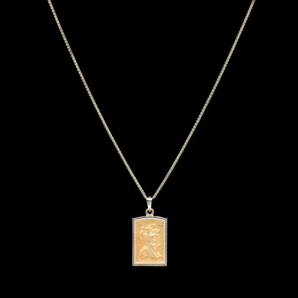 a necklace with a gold pendant on it