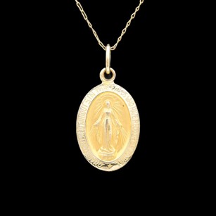 a gold pendant with the image of jesus on it